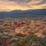 Luxury car service from Colorado Springs to Denver International Airport with mountain landscape background