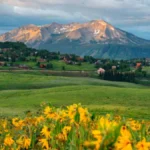 Private shuttle driving from Denver to Crested Butte through scenic Colorado mountains.