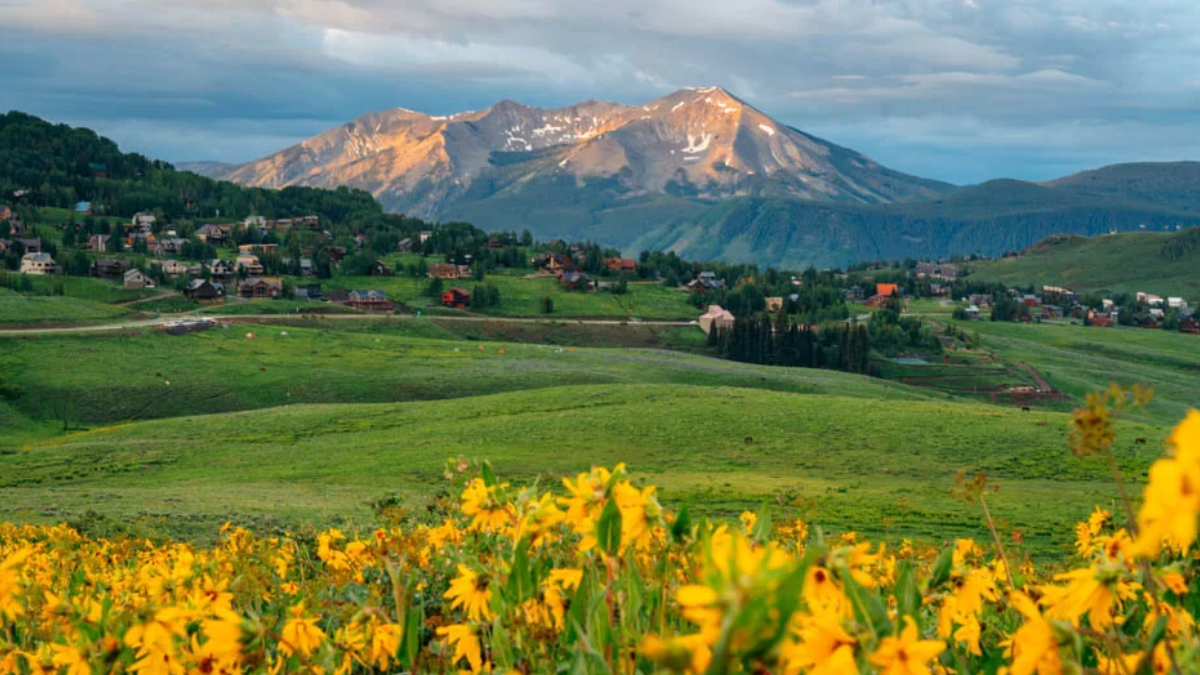Private shuttle driving from Denver to Crested Butte through scenic Colorado mountains.