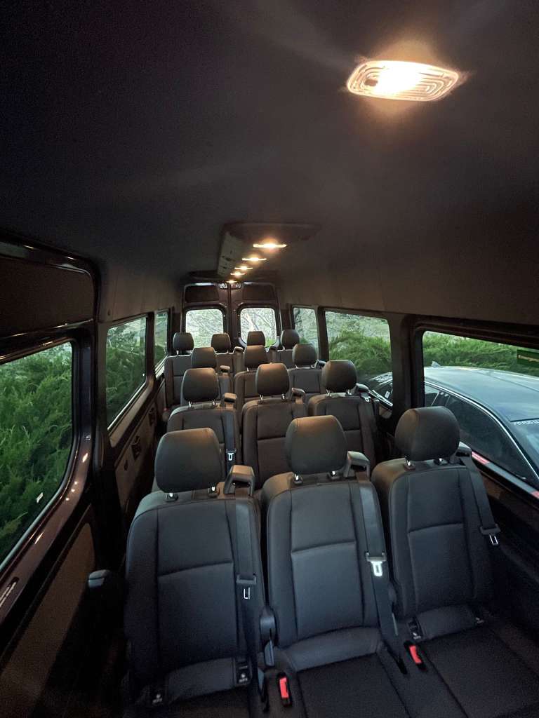 Mercedes Sprinter van interior seating rows Denver shuttle service